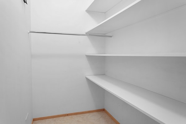Walk-in closet with custom built-in shelving